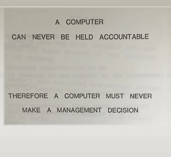 An IBM slide saying a computer can never be held accountable changes into a joke about blaming a computer for doing the hacking.